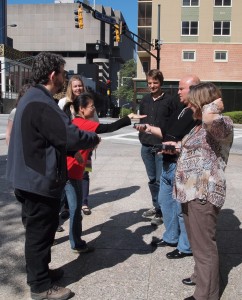 People in the street with Sensory Threads Equipment